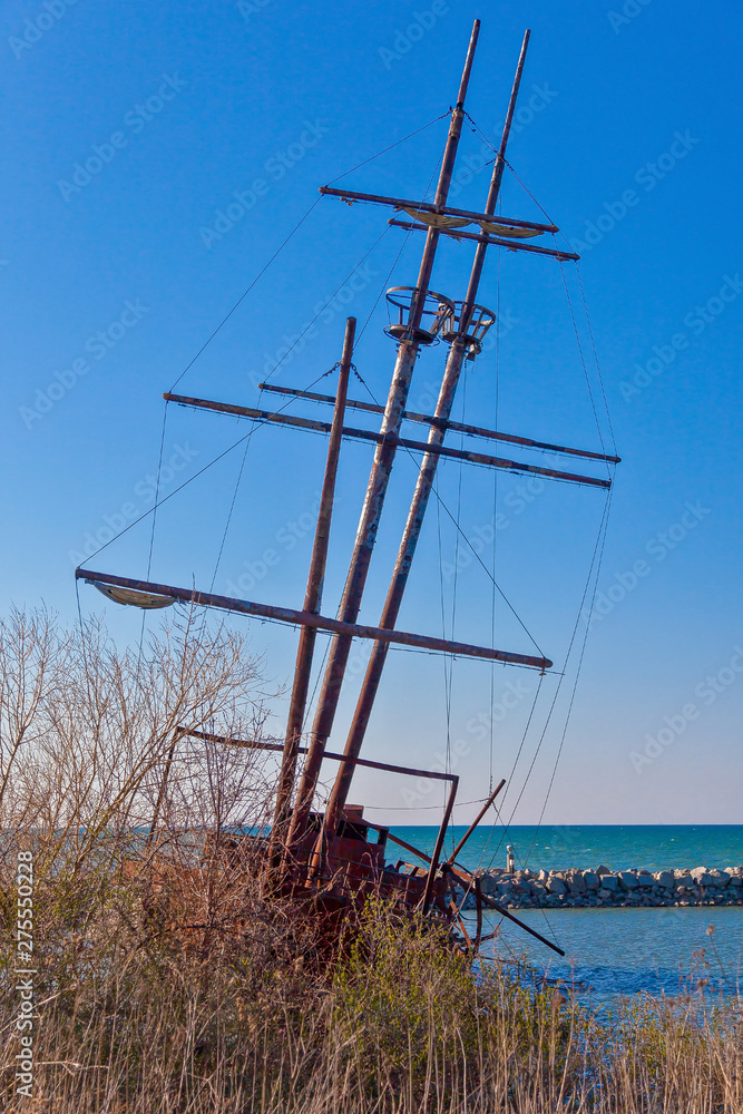 Stranded and damaged sailing ship