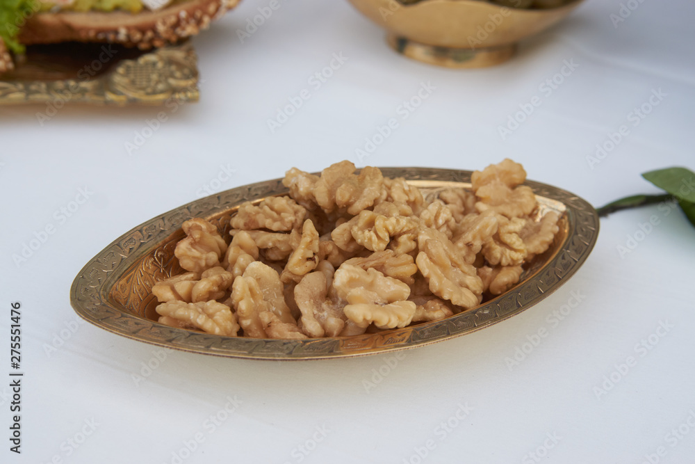Walnuts kernel in metal bowl, close-up, healthy snack food. Walnuts kernel in metal bowl, close-up, healthy snack food.