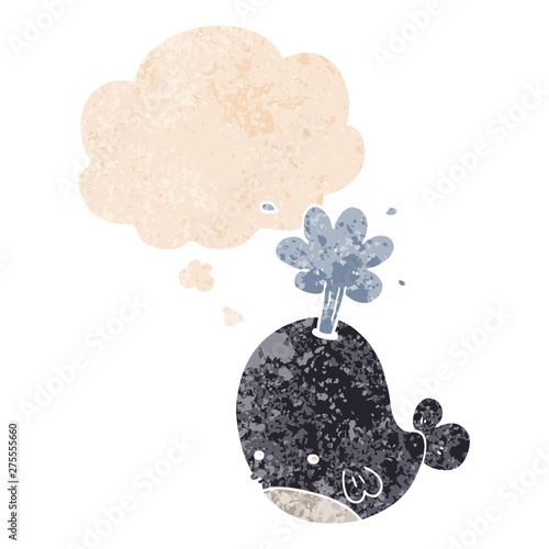 cartoon spouting whale and thought bubble in retro textured style