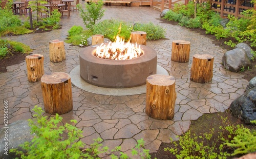 Large outdoor fit pit with tree stumps for chairs