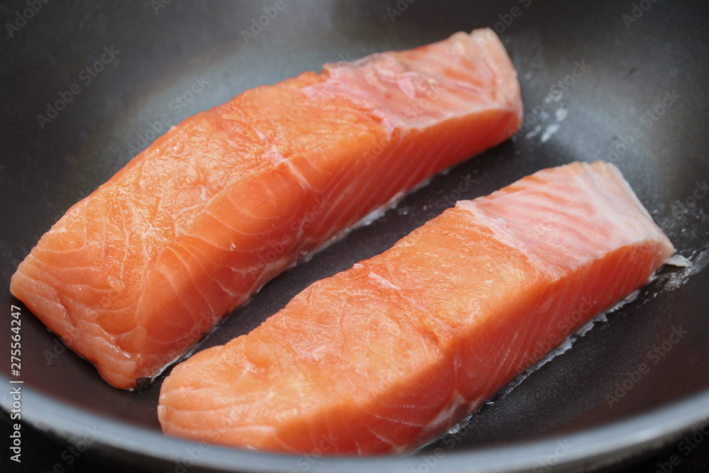 Ready raw fresh salmon for cooking in pan.