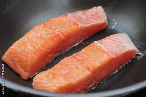 Ready raw fresh salmon for cooking in pan.