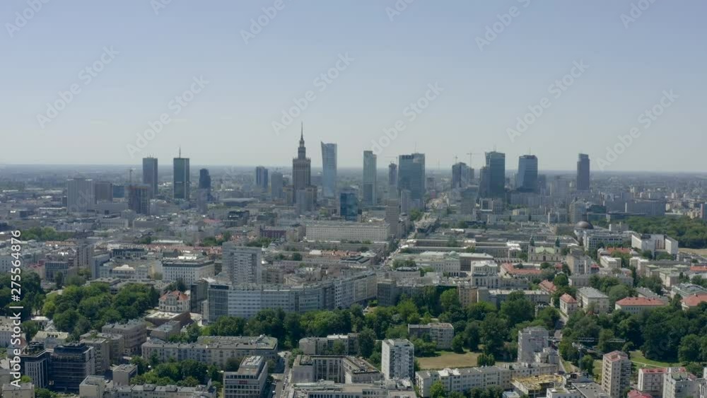 Aerial view of lively Warsaw in Poland, drone flies to the city center. Modern urban architecture of Warsaw skyscrapers, cityscape. 4K Drone shot. Aerial view of lively Warsaw in Poland, drone flies to the city center. Modern urban architecture of Warsaw skyscrapers, cityscape. 4K Drone shot.