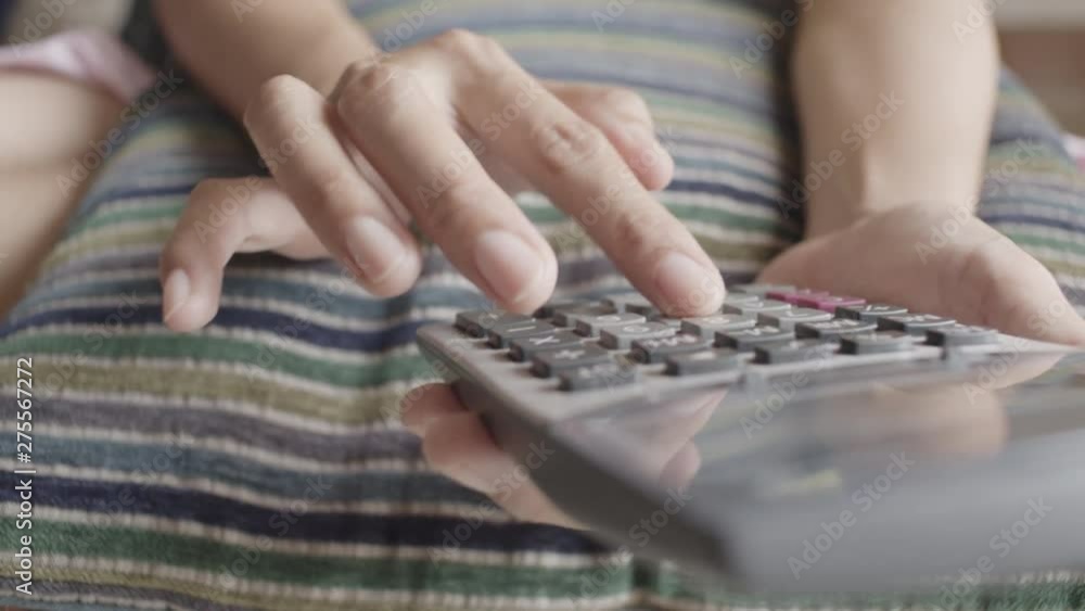 close up picture of hand using calculator close up picture of hand using calculator