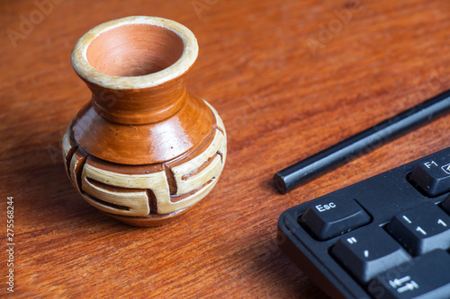 artisan pot of marajoara art on the table photo