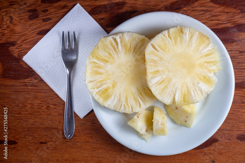 a plate with slices of pineapple