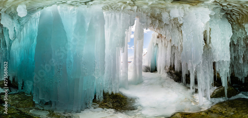 Blue Ice cave grotto on Olkhon Island, Lake Baikal, covered with icicles. Wide panorama