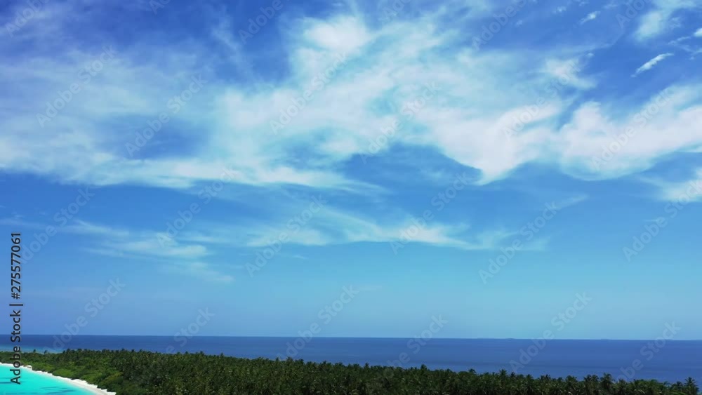 A cloudy blue sky above an island in Hawaii. 2 thirds is sky. Pan right A cloudy blue sky above an island in Hawaii. 2 thirds is sky. Pan right