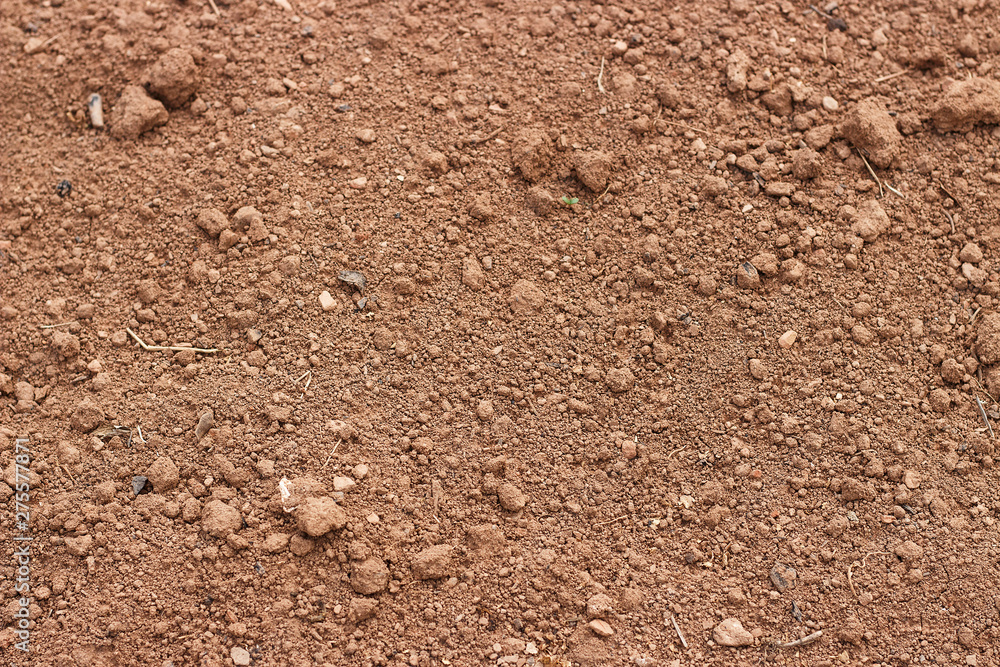 Brown soil close up, texture, natural background, view from above Brown soil close up, texture, natural background, view from above
