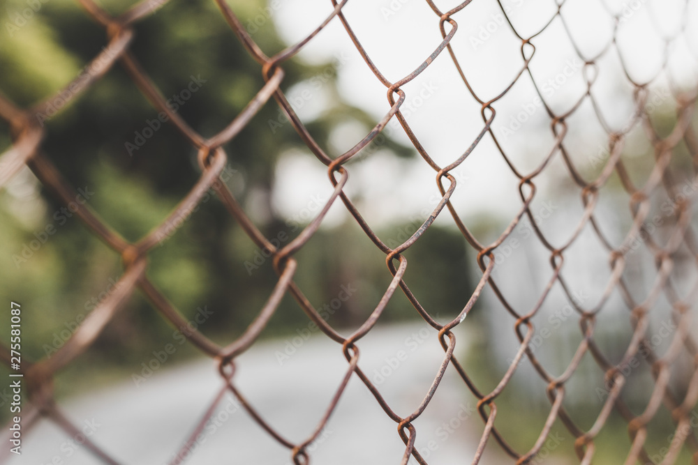 Fototapeta premium Fence grilles rust on blurred background