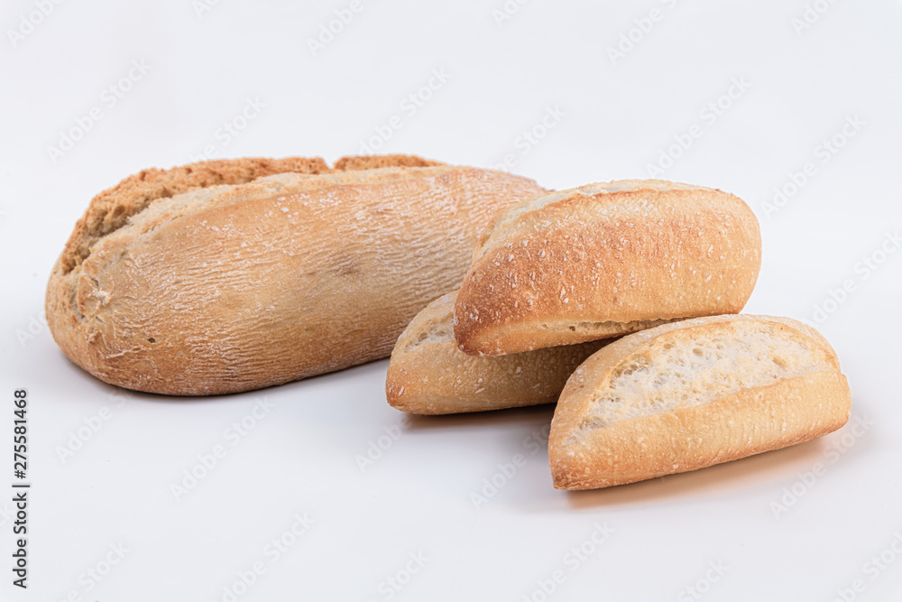 Homemade wholemeal bread with small loaf of bread on white background