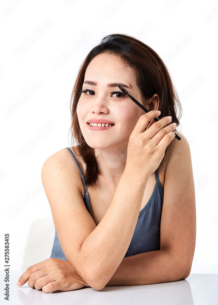 woman applying make-up cosmetic woman applying make-up cosmetic