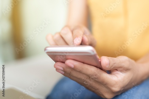This image is a picture of a hands playing a smart phone.The concept is technology,working woman,business,communication.
