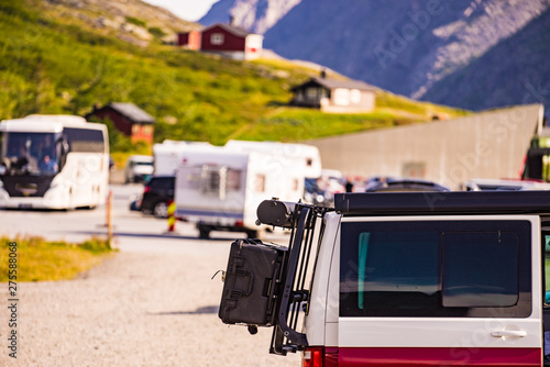Van with rack on parking area.