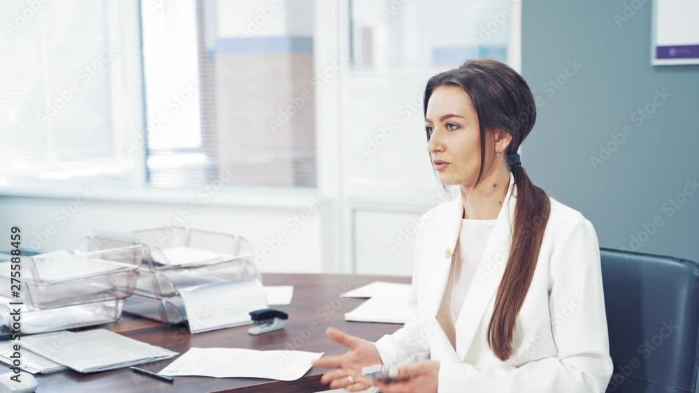 Doctor talking to patient in office. Doctor and patient are discussing something Doctor talking to patient in office. Doctor and patient are discussing something