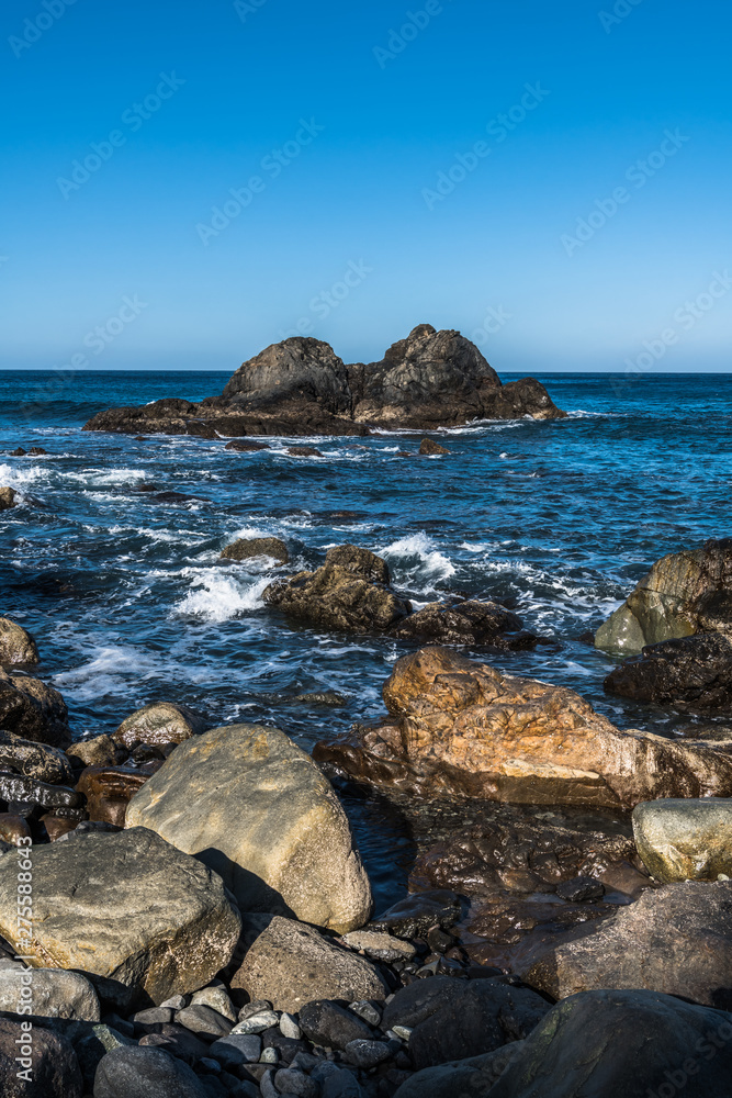 A small rocky island in the ocean