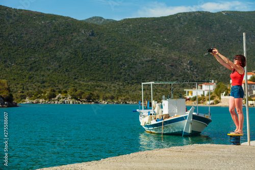 Tourist take photo in greek marina © anetlanda