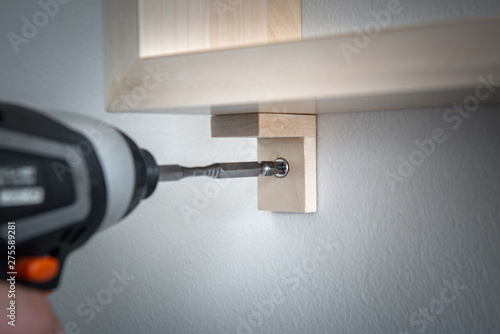 Conceptual image to screw with electric drill