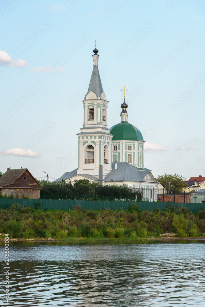 A small village church on a high hill. Church on the banks of the river. Old Orthodox Church.