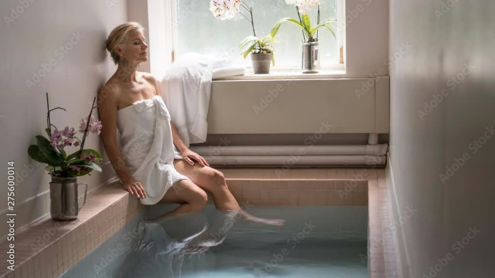 Cinemagraph of a beautiful mature woman relaxing in roman baths at Berkeley Springs State Park. Cinemagraph of a beautiful mature woman relaxing in roman baths at Berkeley Springs State Park.