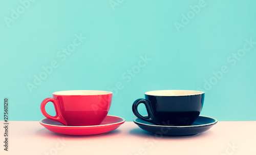 Two a cup of coffee on colorful pastel background