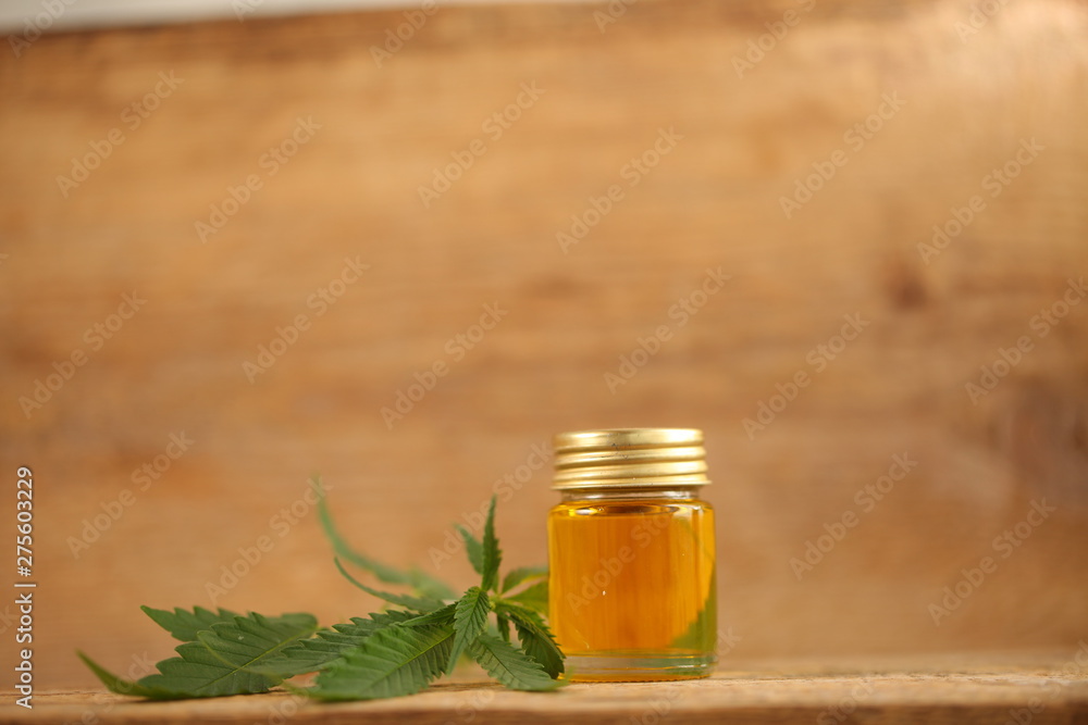 cbd oil bottle and hemp leaf cbd oil bottle and hemp leaf