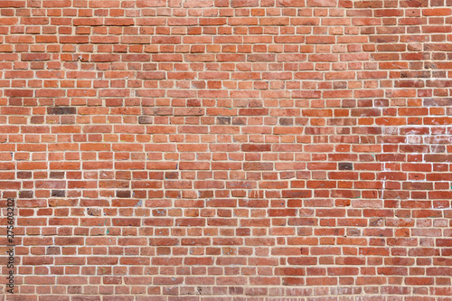Old red brick wall background. Panoramic wide texture