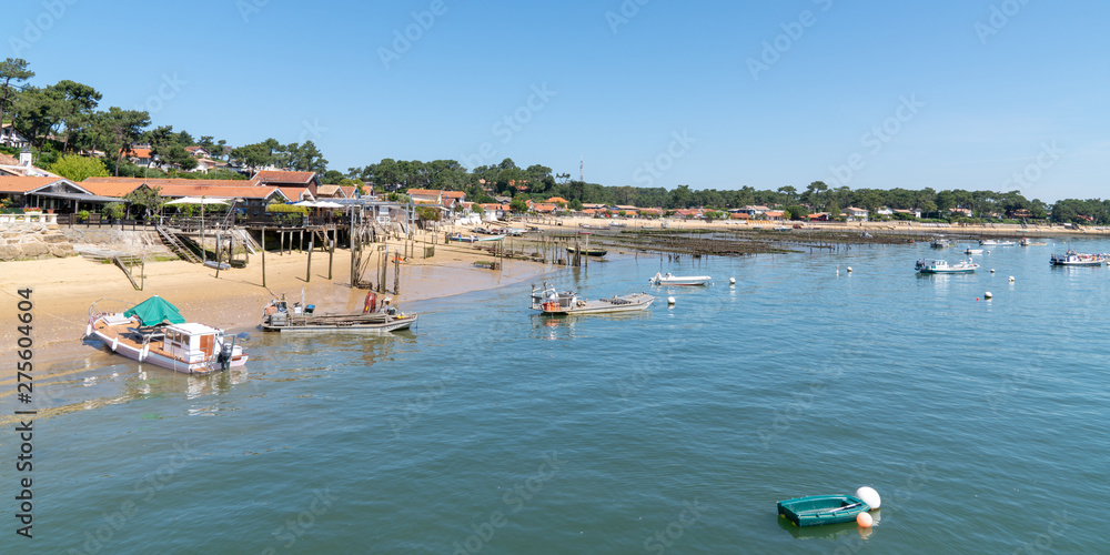 Coastline of Arcachon bay in Le Canon village in Cap-Ferret France in web banner template Coastline of Arcachon bay in Le Canon village in Cap-Ferret France in web banner template