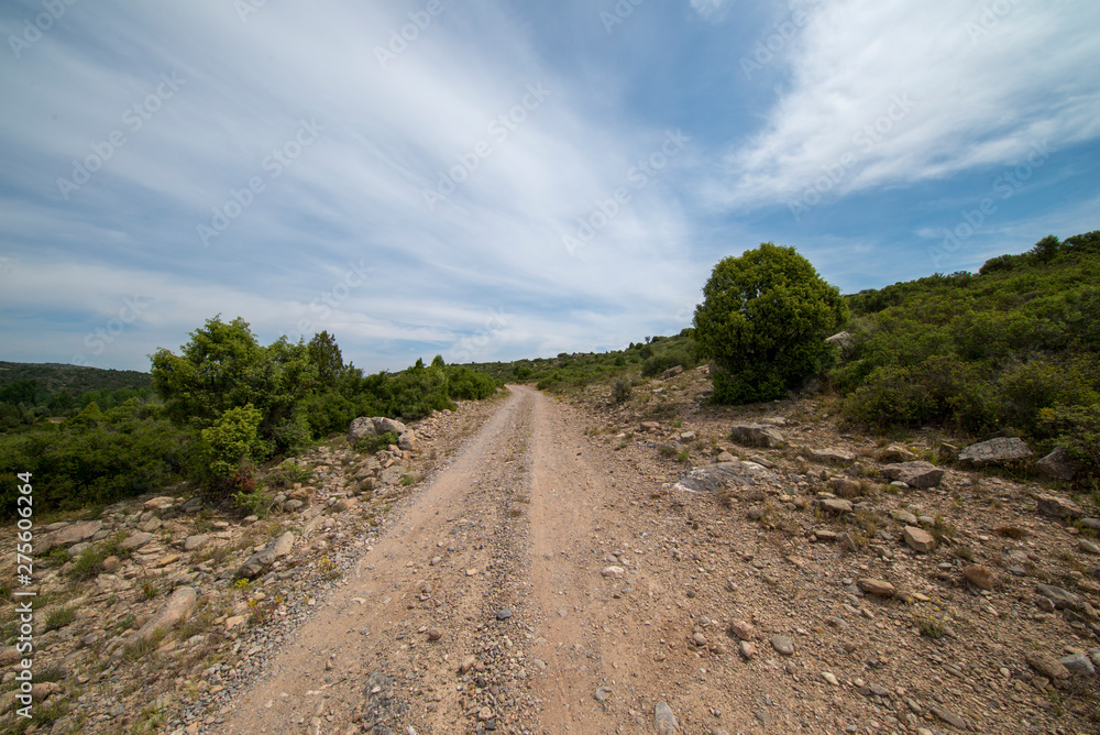 Rural road between mountains of the Sierra de Gudar, Valbona