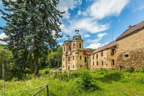 Skoky, Zlutice / Czech Republic - June 21 2019: Baroque church of the Virgin Mary Visitation in Skoky, Maria Stock, is a former pilgrimage place in West Bohemia. Sunny day, blue sky with clouds.