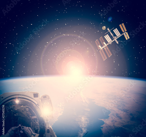 Fototapeta Naklejka Na Ścianę i Meble -  Space craft and earth. Austronaut makes selfie. The elements of this image furnished by NASA.