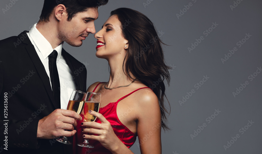 Beautiful couple celebrating with champagne Beautiful couple celebrating with champagne