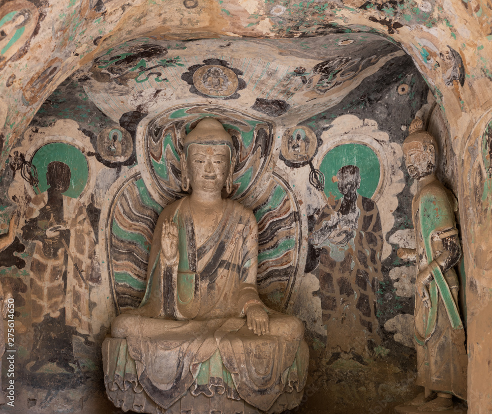 Clay statue of sitting Buddha in Grotto 82 carved in Northern Zhou Dynasty with colorful fresco in Bingling Temple and Grottoes, Yongjing, Gansu. UNESCO World Heritage.