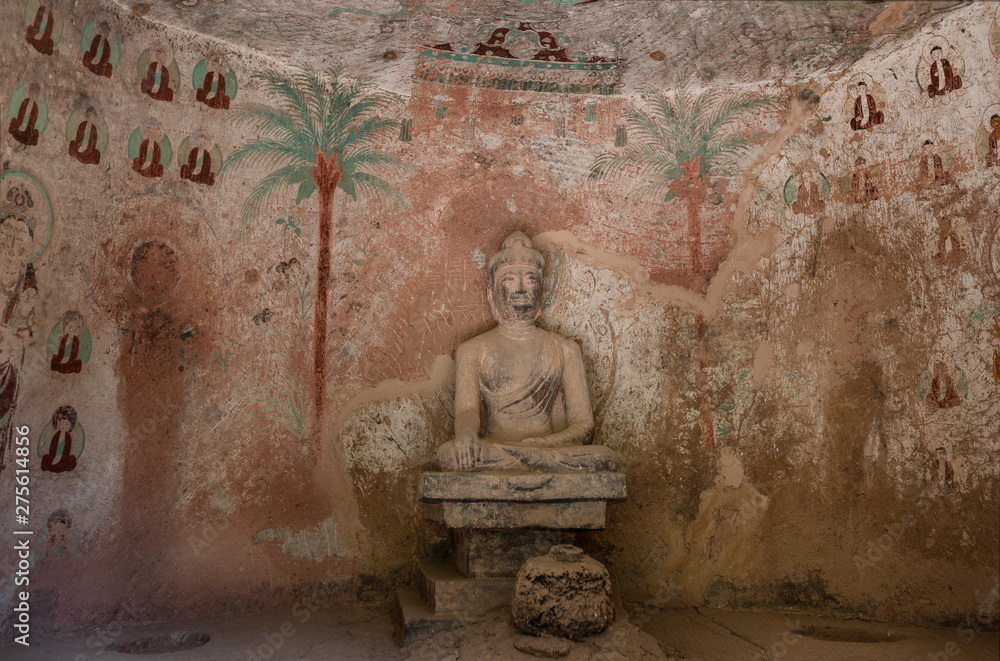 Buddha statue with colorful fresco in Grotto 11 carved in a period during Tubo Regime in late Tang Dynasty in Bingling Temple and Grottoes, Yongjing, Gansu. UNESCO World Heritage. Buddha statue with colorful fresco in Grotto 11 carved in a period during Tubo Regime in late Tang Dynasty in Bingling Temple and Grottoes, Yongjing, Gansu. UNESCO World Heritage.
