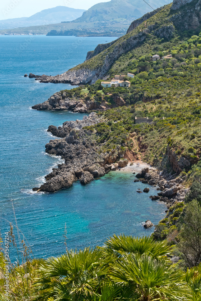 The crystal clear waters waters of Cala Beretta in the Oasi dello Zingaro natural reserve, San Vito Lo Capo, Sicily