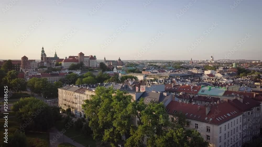 Skyline panorama of Krakow, Poland, with Royal Wawel Castle, Cathedral, Vistula River, bridge, harbor, ships and onboard restaurant. Aerial view in fall in sunset light. Skyline panorama of Krakow, Poland, with Royal Wawel Castle, Cathedral, Vistula River, bridge, harbor, ships and onboard restaurant. Aerial view in fall in sunset light.