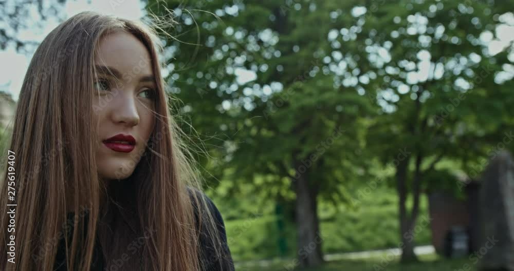 Attractive young woman with her long hair blowing - slow motion. Attractive young woman with her long hair blowing - slow motion.