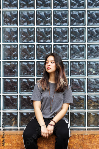 A Portrait Of A Young And Beautiful Asian Girl Chinese Teen Girl Against A Wall Of