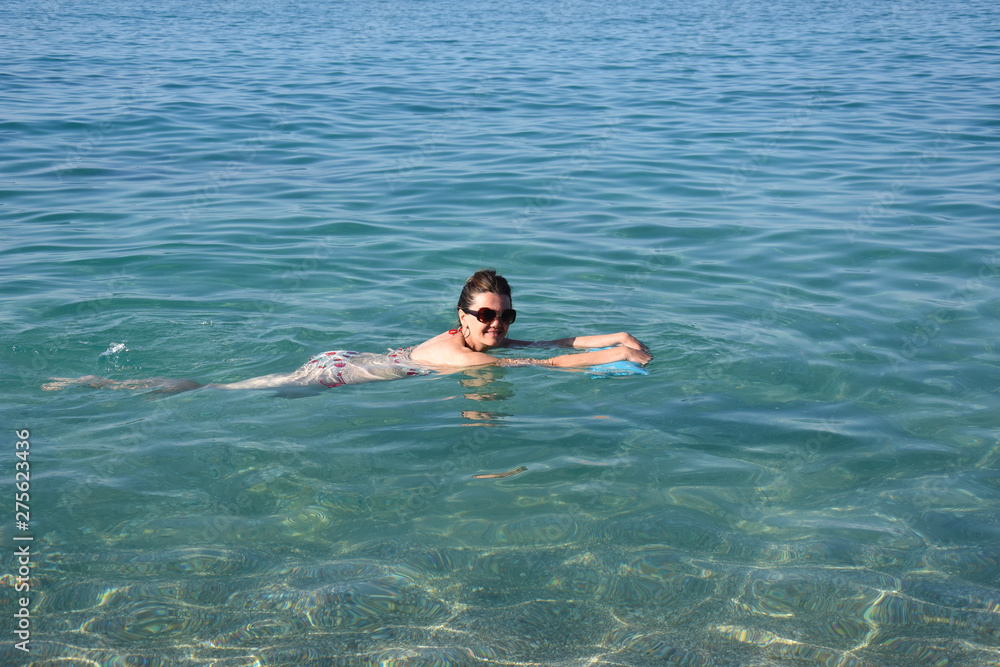 Woman swimming in the sea. Wife enjoy at sea