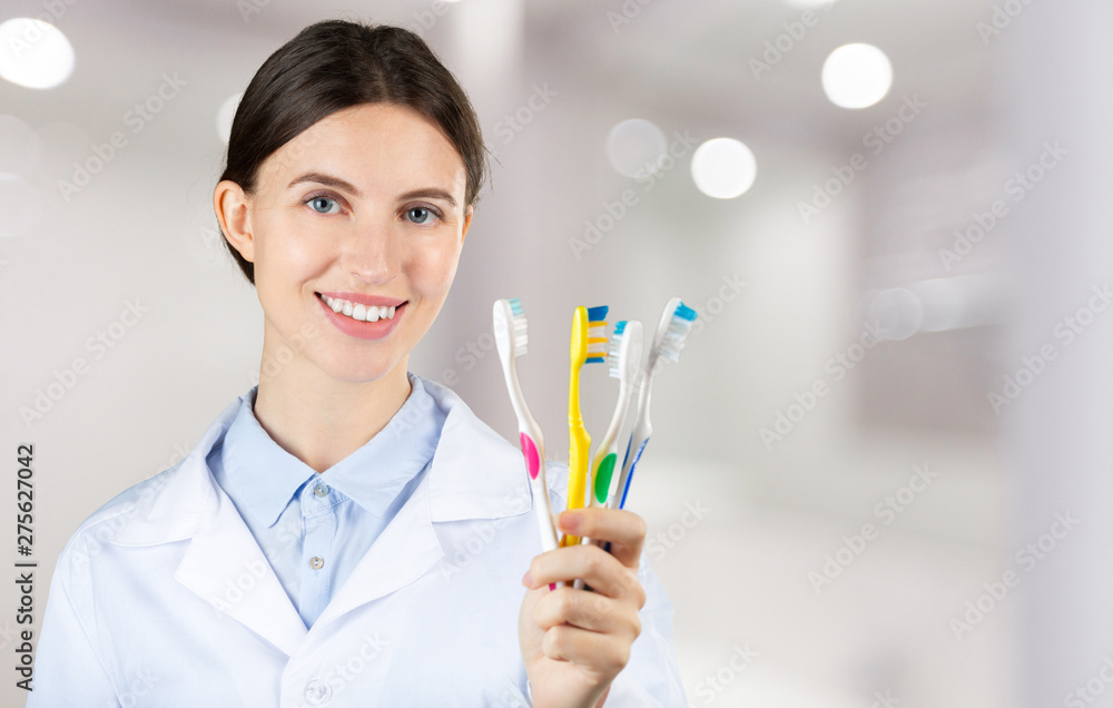 picture of attractive female dentist with tools picture of attractive female dentist with tools