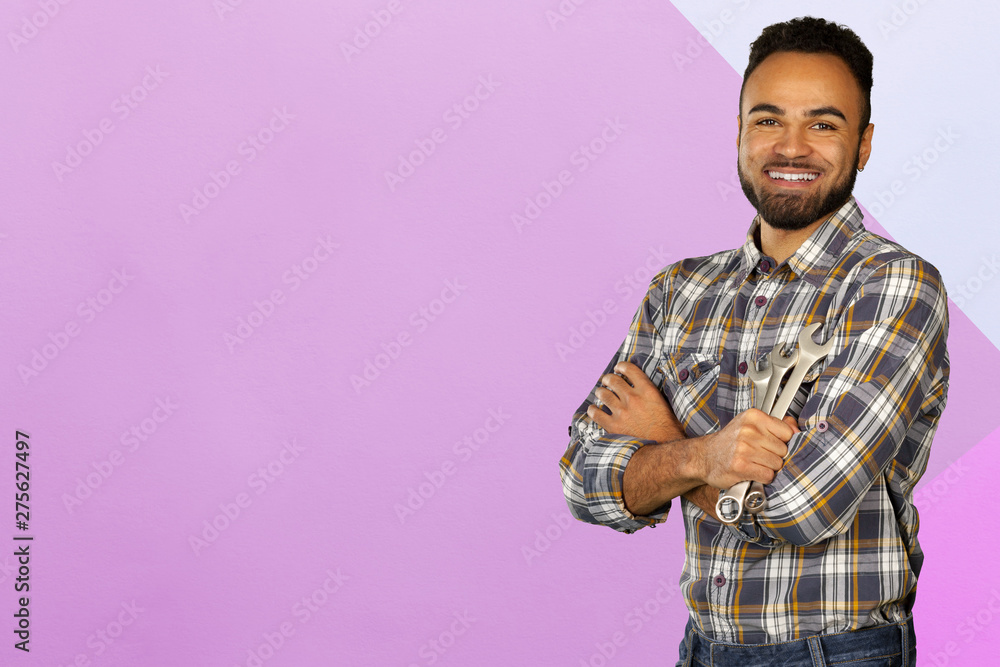Portrait of stong and handsome african male student looking at camera smiling Portrait of stong and handsome african male student looking at camera smiling