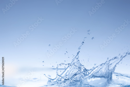 water splash isolated on blue background , 