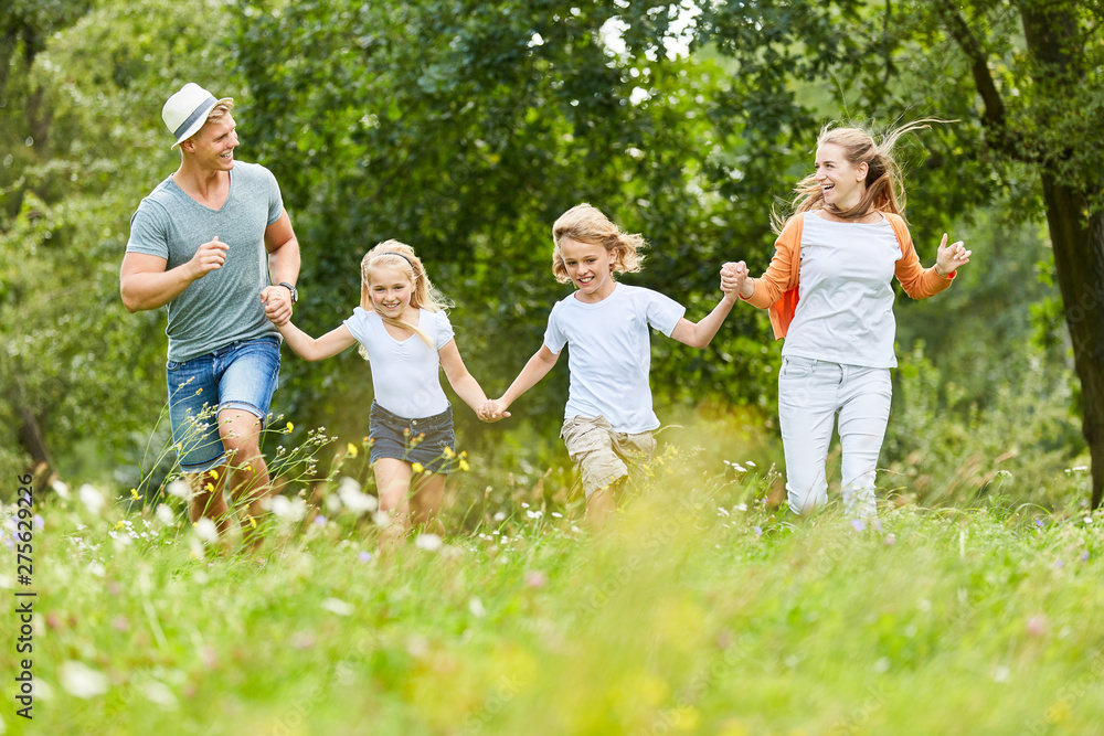 Happy family in the nature in the summer