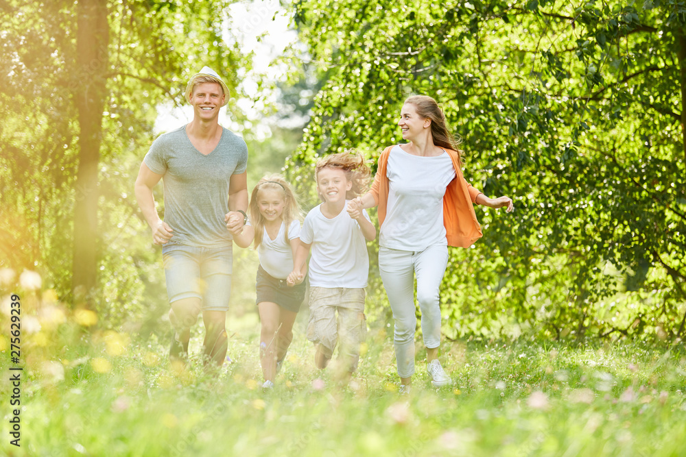 Obraz premium Family and children in spring in the nature