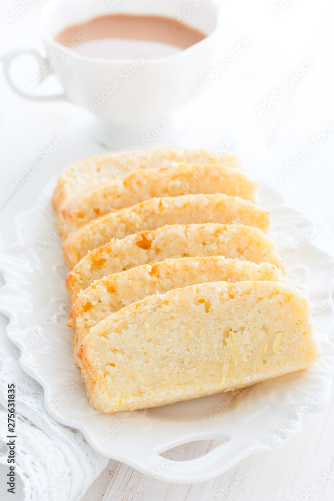 lemon zucchini cupcake, cut into pieces on a white plate, selective focus lemon zucchini cupcake, cut into pieces on a white plate, selective focus
