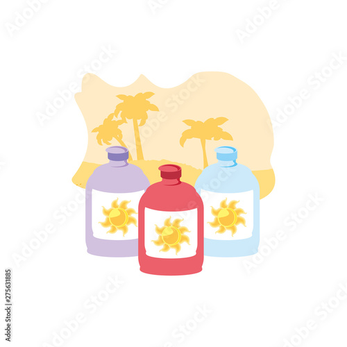 set of solar blocker bottles in the beach