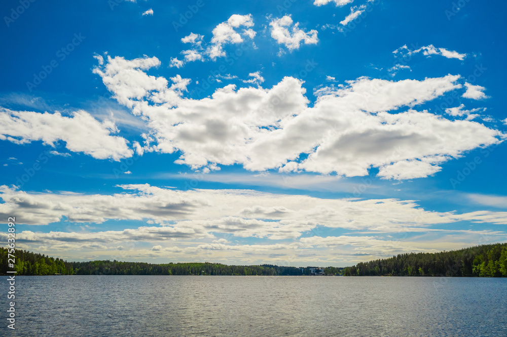 Lake, clouds and sky landscape. Forest on background. Imatra. Finland Lake, clouds and sky landscape. Forest on background. Imatra. Finland