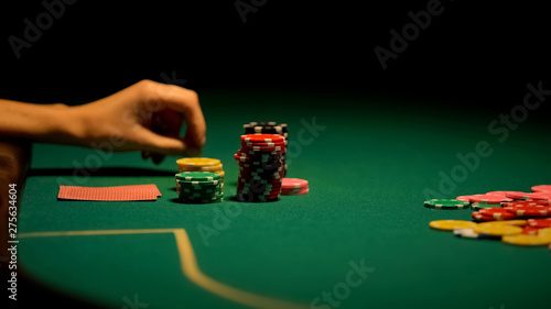 Obraz na plátně Female hand playing poker, gambling addiction, beginner in casino, fortune