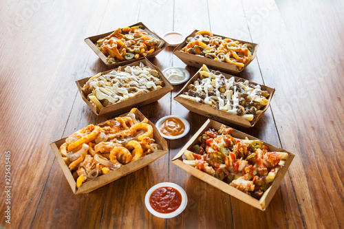 French fries poutine different flavours with dip sauces photo