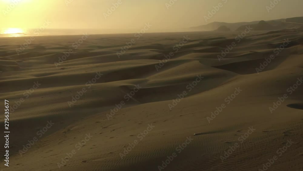 FORWARD LOW FLIGHT OVER SAND DUNES IN PERU DESERT AT SUNSET FORWARD LOW FLIGHT OVER SAND DUNES IN PERU DESERT AT SUNSET